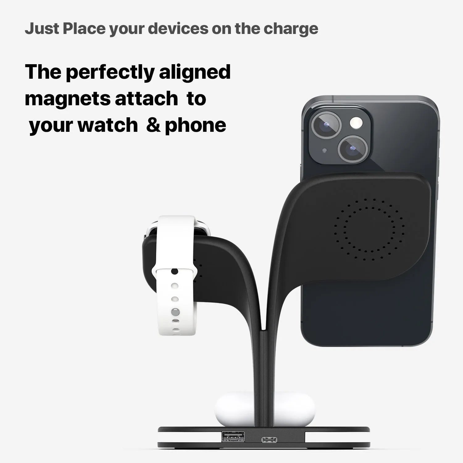 Black wireless charging stand holding a phone, a smartwatch, and wireless earbuds on a desk.