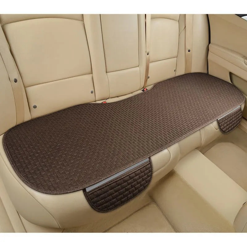 Linen car cushion with hemmed edges in plaid pattern for business vehicle seating