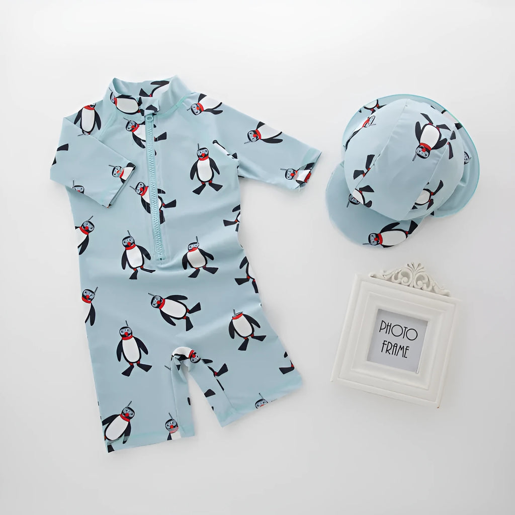 Boys penguin print long sleeve swimsuit with matching swimming cap