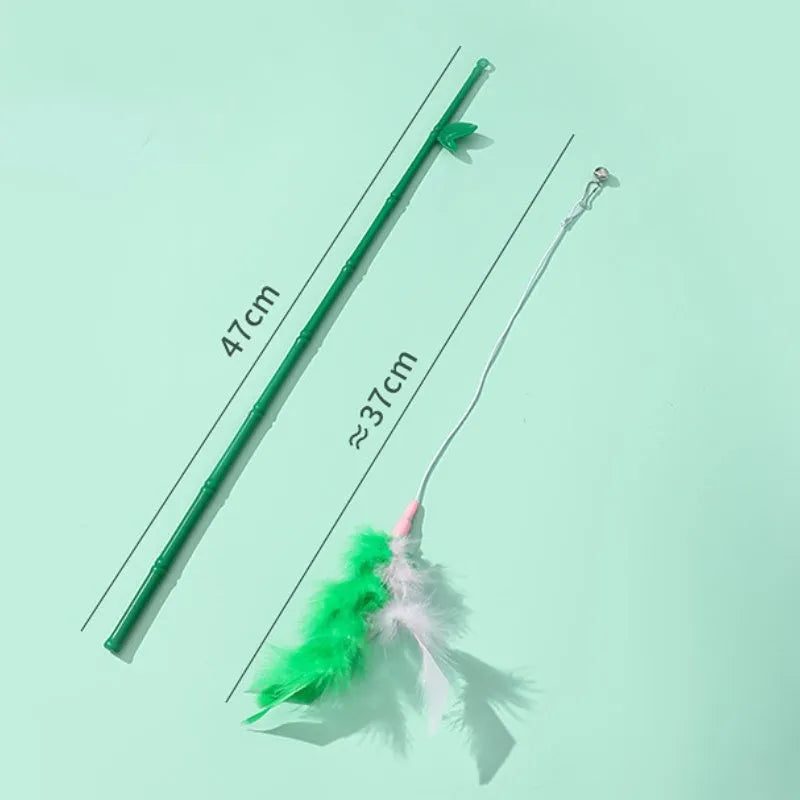 Green interactive cat wand toy with feathers and a bell on a durable plastic handle.
