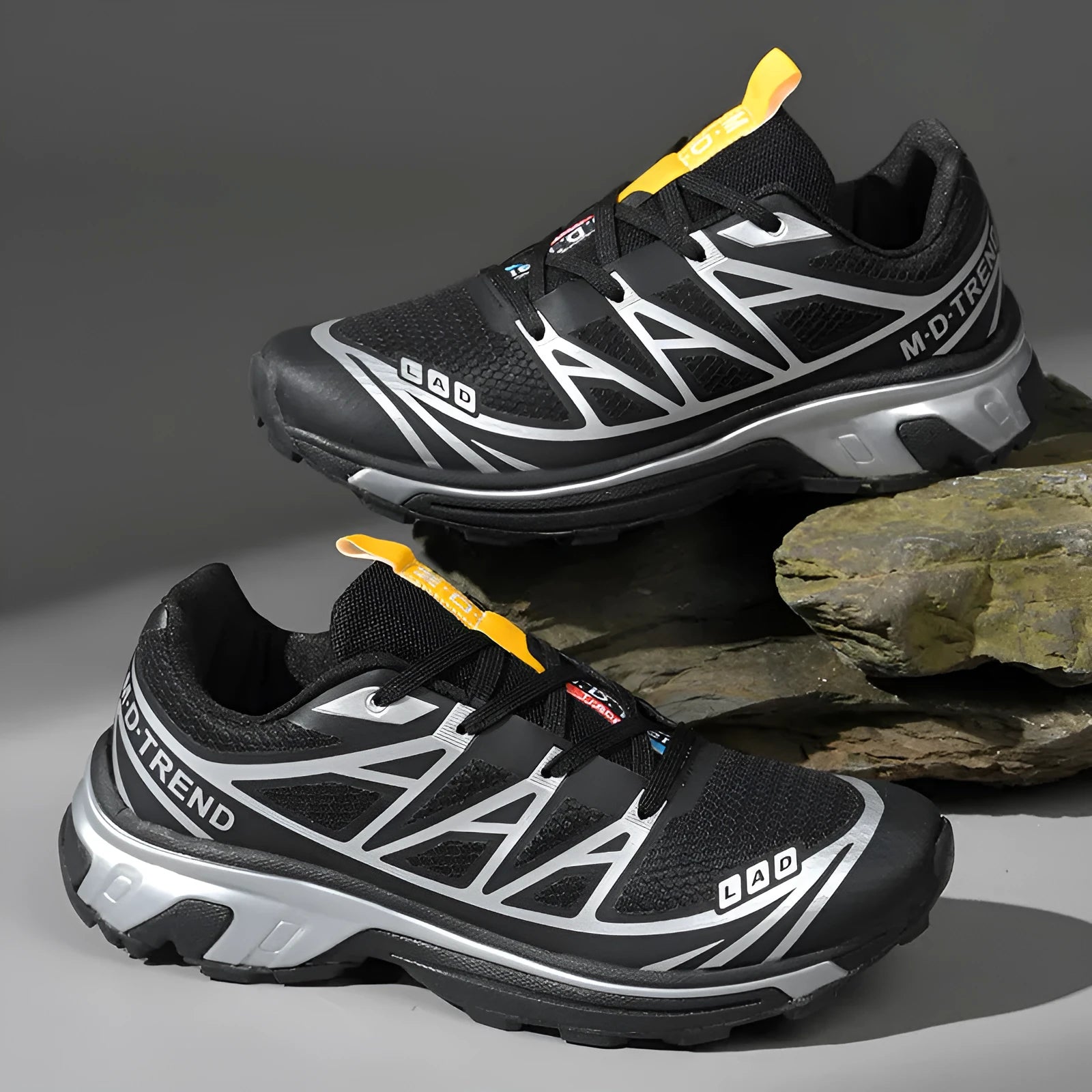 Men's and women's low-top artificial leather hiking shoes in multiple colours with flat rubber sole and lace-up front.