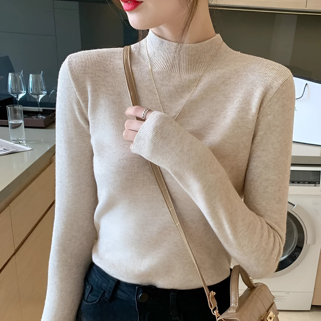 Women's slim fit knitted long sleeve top in viscose fabric, shown in apricot colour.