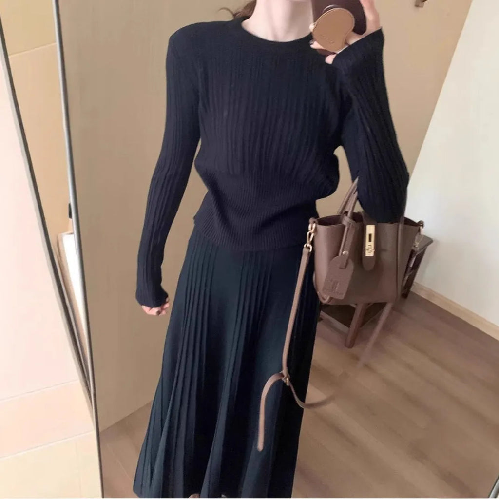 Dark grey knitted women's long dress suit with sweater, skirt, and 3D artistic pattern.