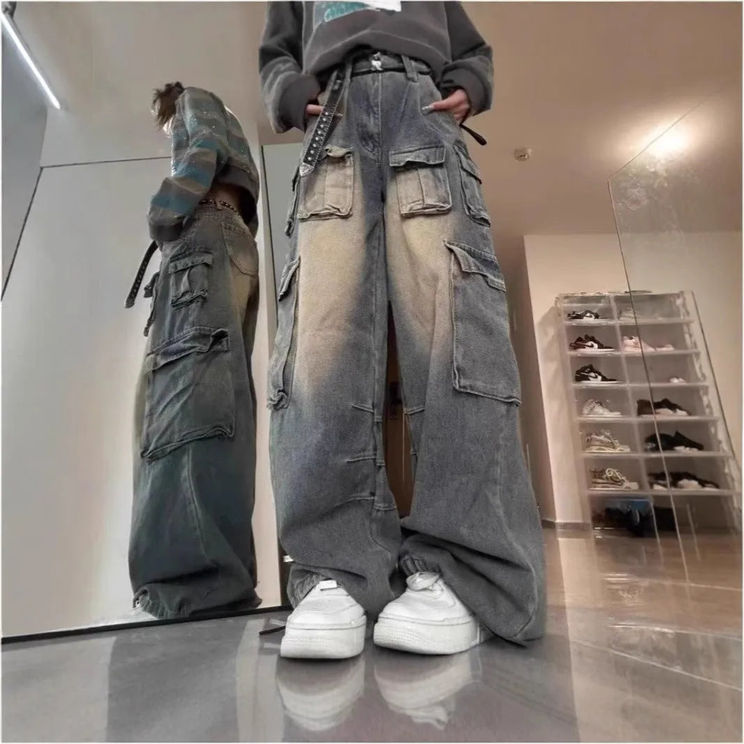 Man wearing light blue loose-fit distressed jeans with multiple pockets, showcasing street hipster style.
