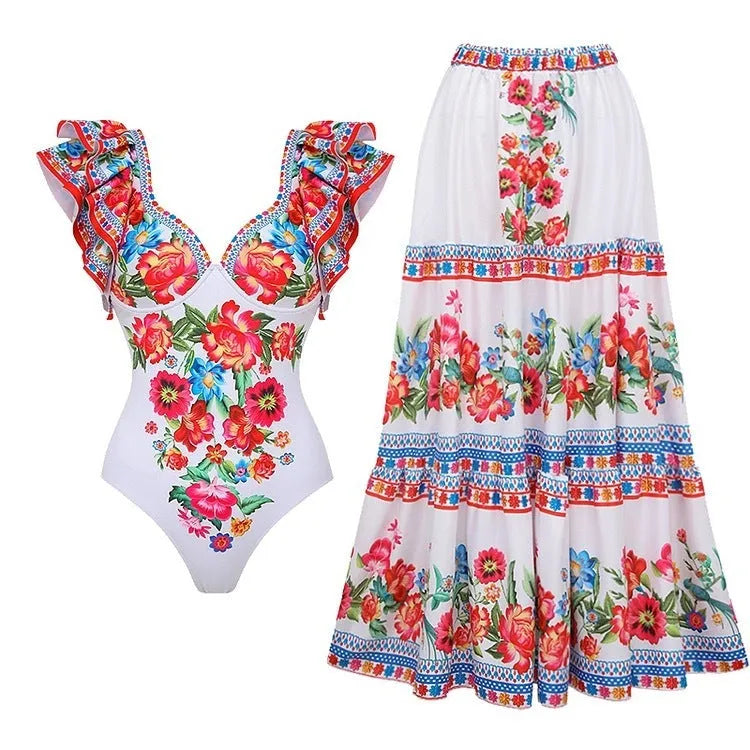 Women's printed polyester one-piece swimsuit on a hanger showing rose pink colour.