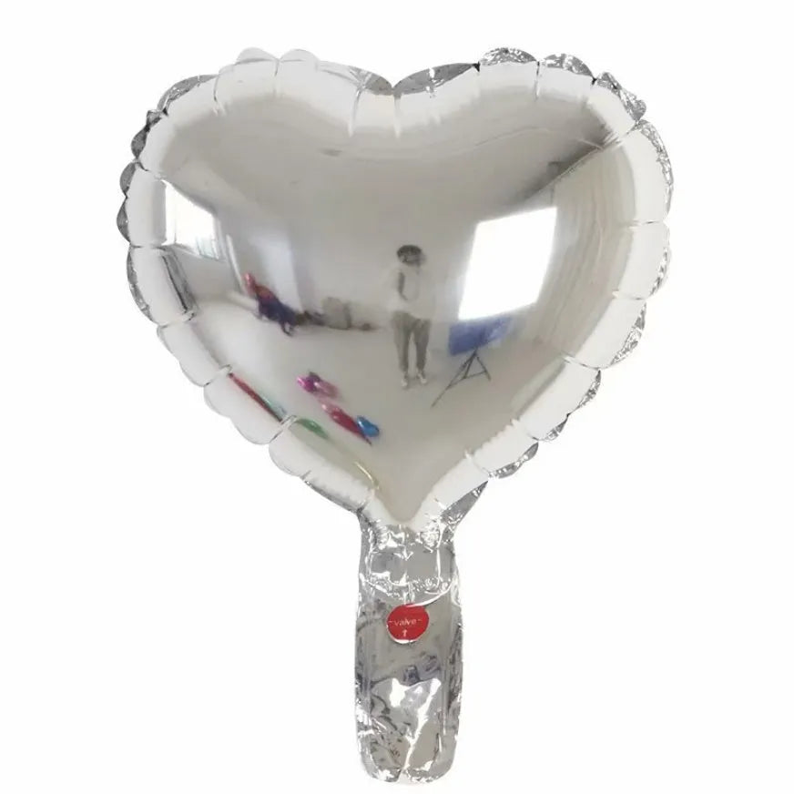 Five peach heart shaped aluminum balloons in metallic colours for party decorations