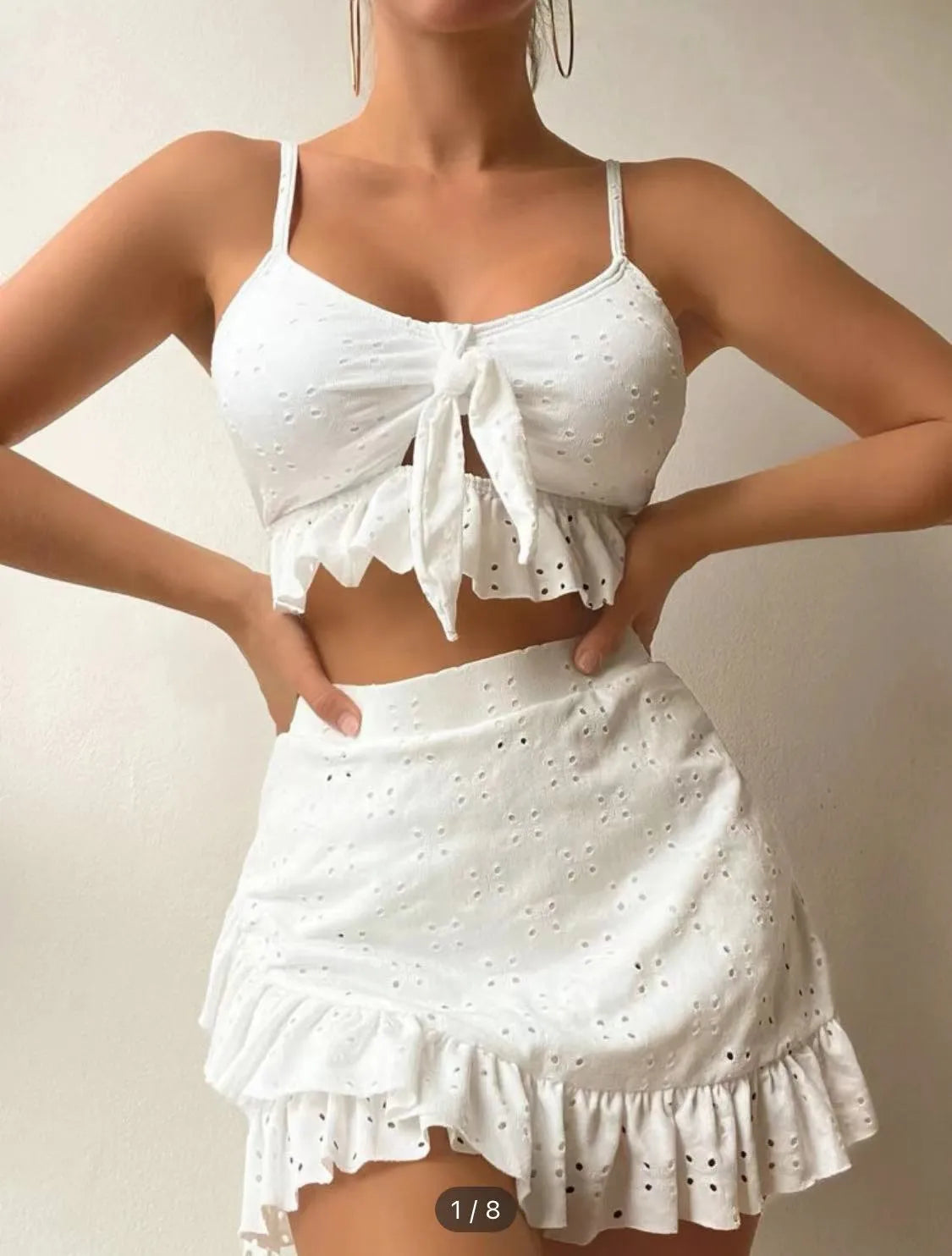 Women's three-piece bikini set with split hip skirt in polyester fabric for swimming