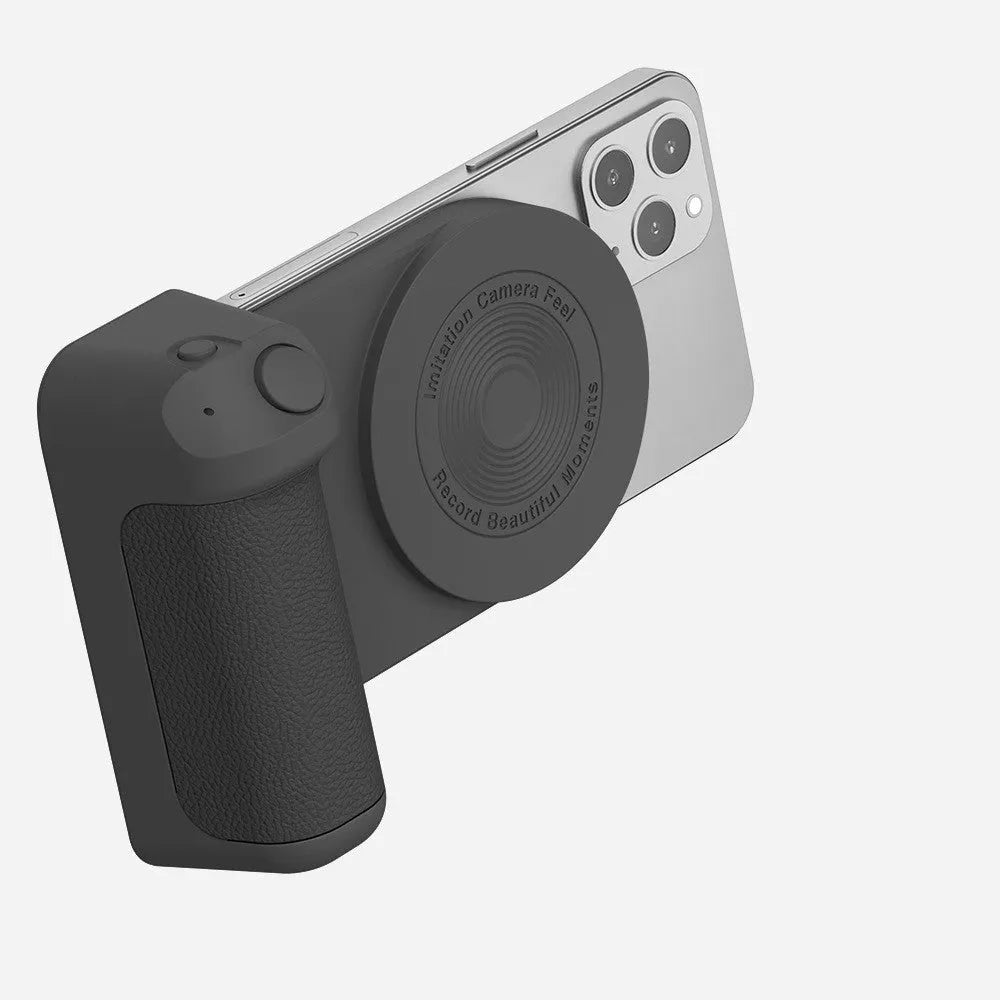 Black multifunctional magnetic phone camera holder with ergonomic PU leather grip on a table.