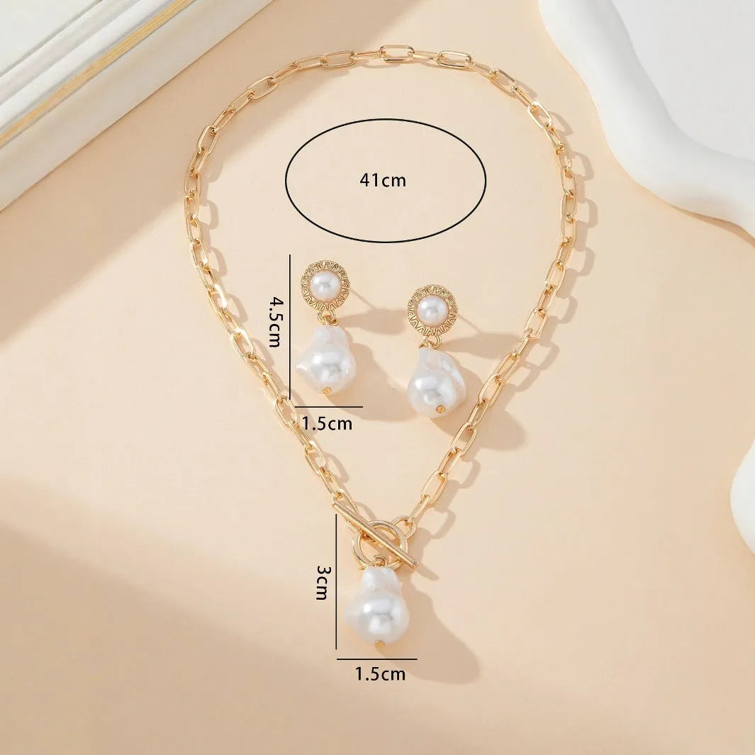 Gold baroque pearl pendant necklace and matching stud earrings jewellery set