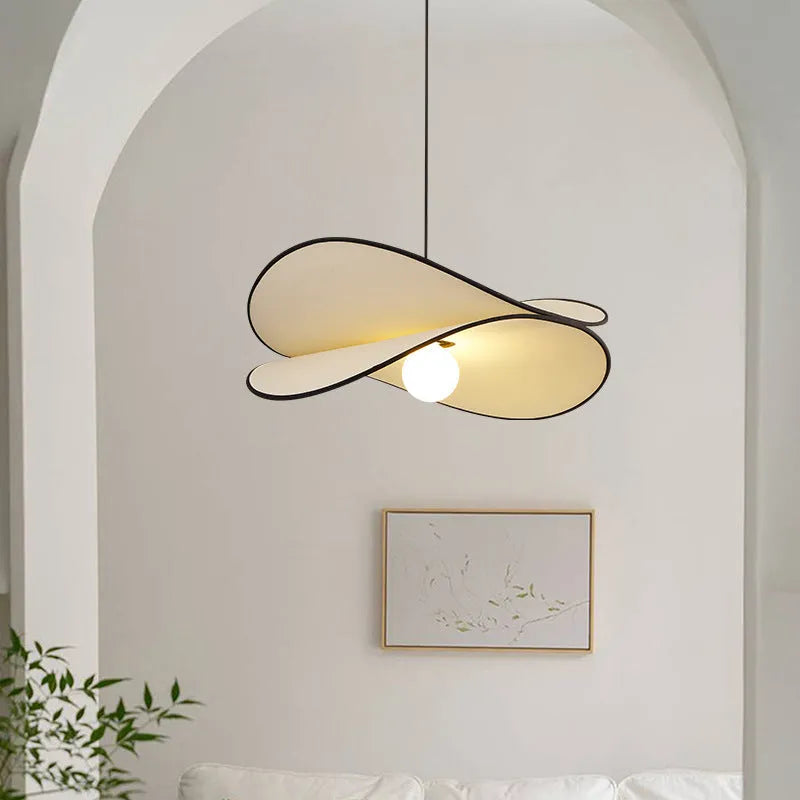 French artistic modern fabric potato chips chandelier pendant light in a bedroom setting.