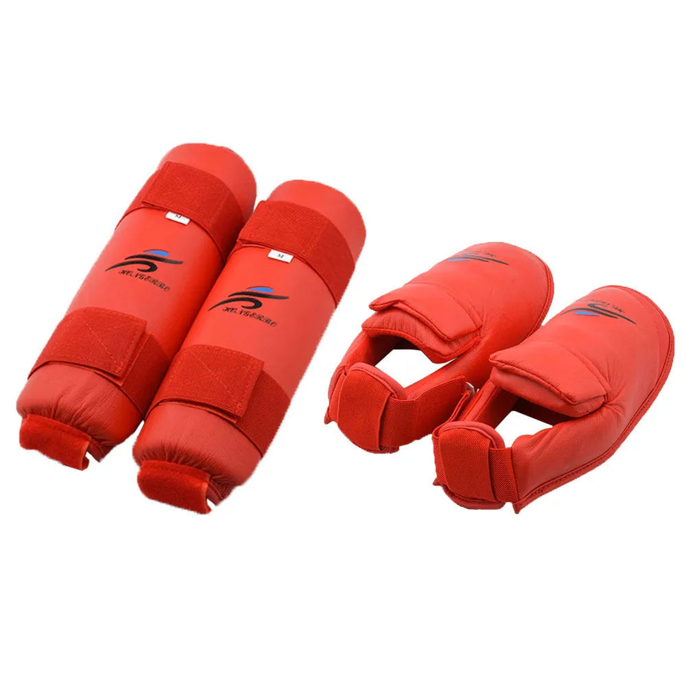 Red and blue martial arts protective gear set showing leg guards, helmet and boxing gloves for karate taekwondo training