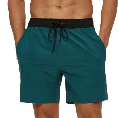 Men's blue polyester running shorts with a drawstring waist and a side headband pocket.