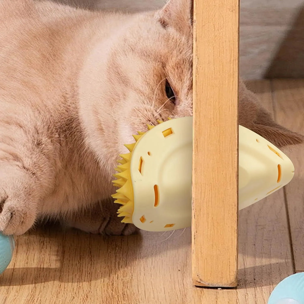 Yellow durian-shaped cat corner scratcher and grooming comb mounted on a wall.