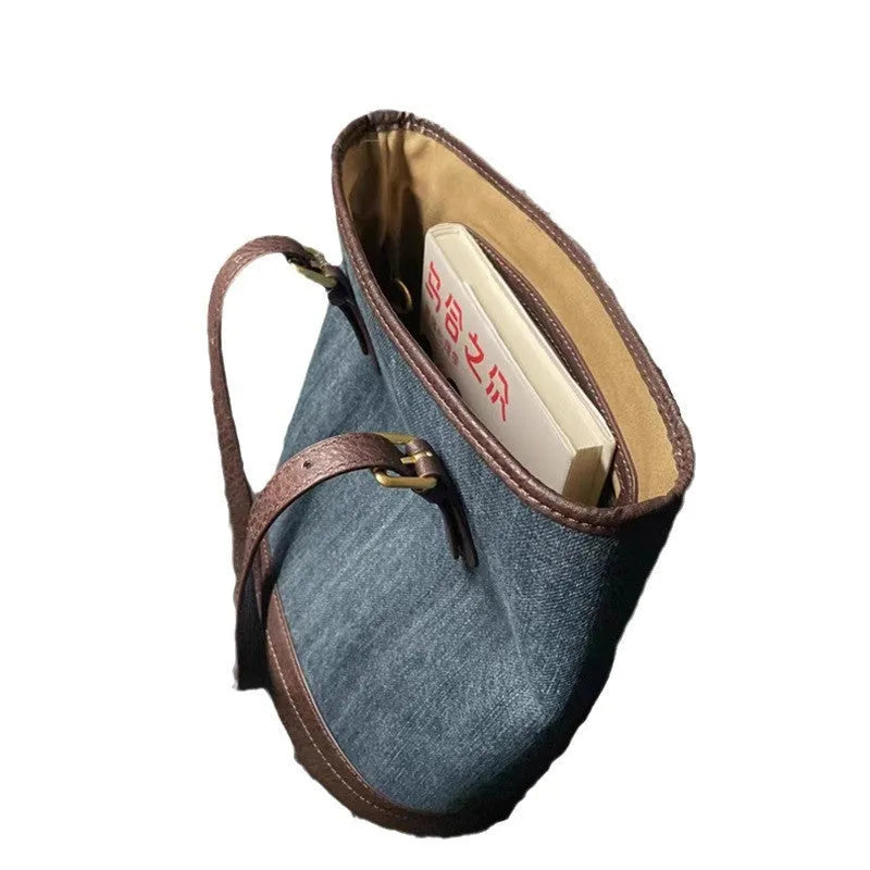 Denim patchwork bucket handbag with one-shoulder strap showing 23x27x16cm dimensions