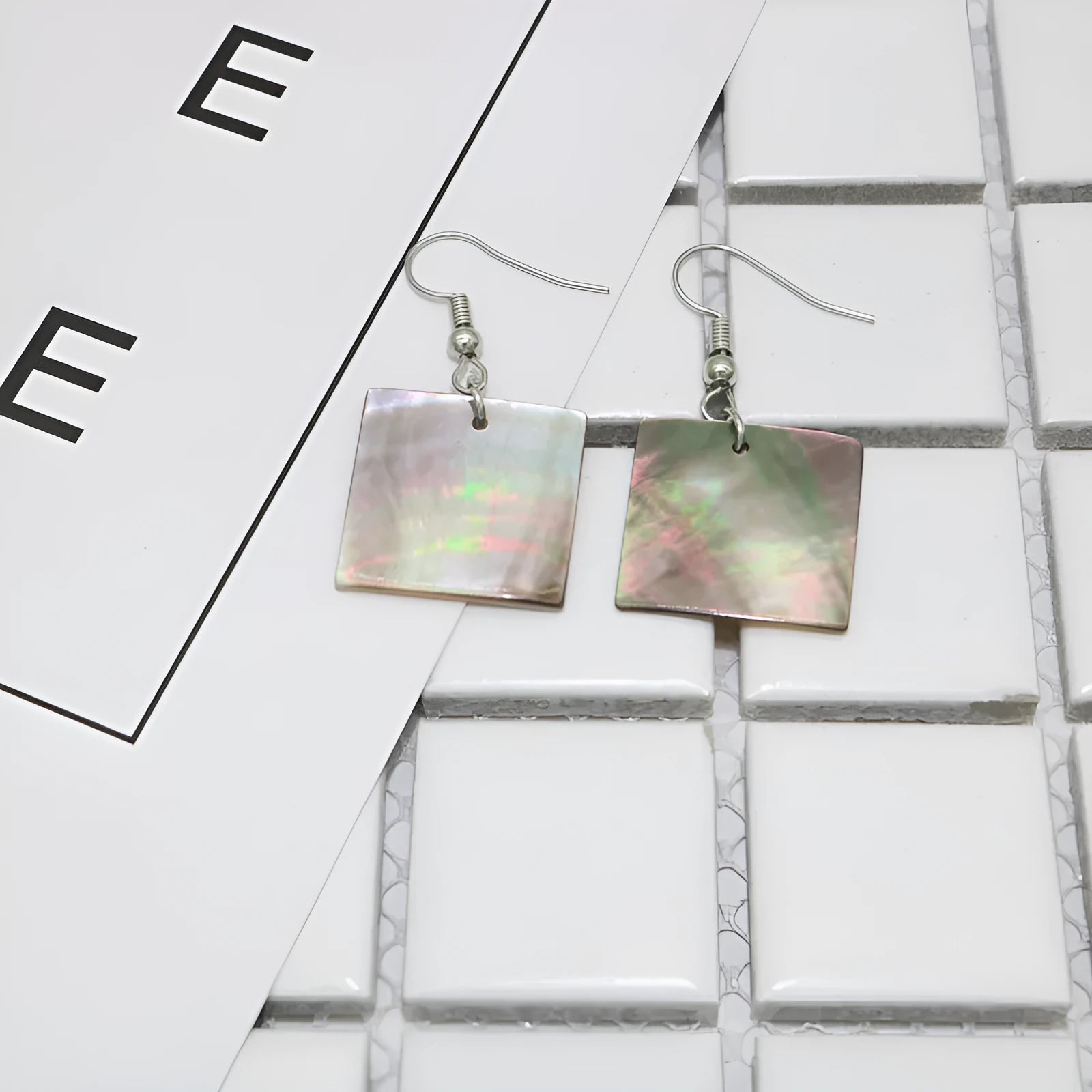 Women's geometric shell earrings in rectangular and square panther natural colours