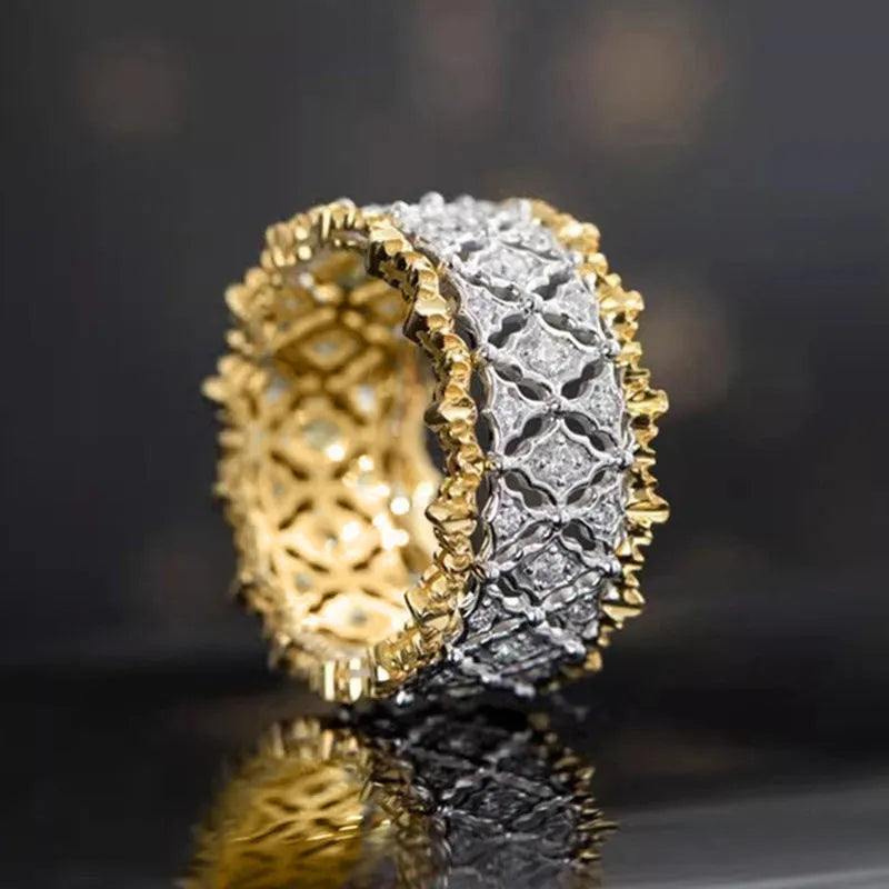 Gold two-tone geometric ring with round zircon details on a copper band.