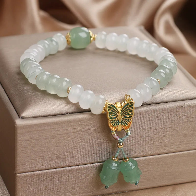 Green women's bracelet with Tian Shan Cui abacus beads and butterfly tassel