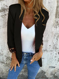 Slim fit black cheetah print blazer with regular sleeves on a hanger