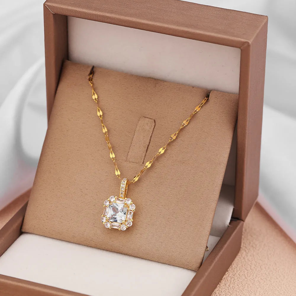 Women's geometric clavicle chain with quadrilateral pendant containing mixed gem inlays on water wave titanium steel chain