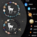 Set of twelve beaded bracelets with natural stone beads on adjustable cords, each representing a different zodiac sign.