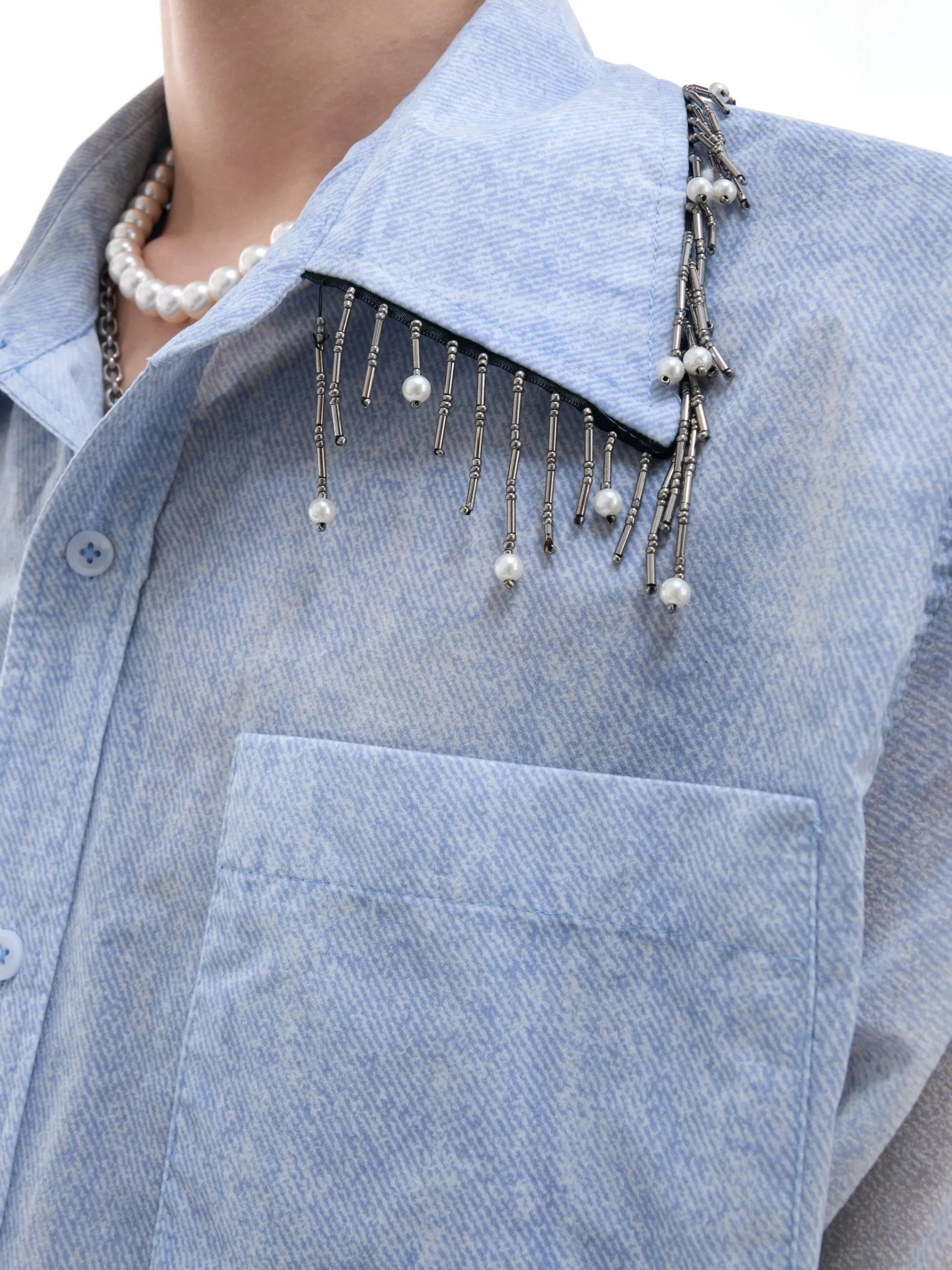 Man wearing a loose-fit gradient blue short-sleeved polyester casual shirt.
