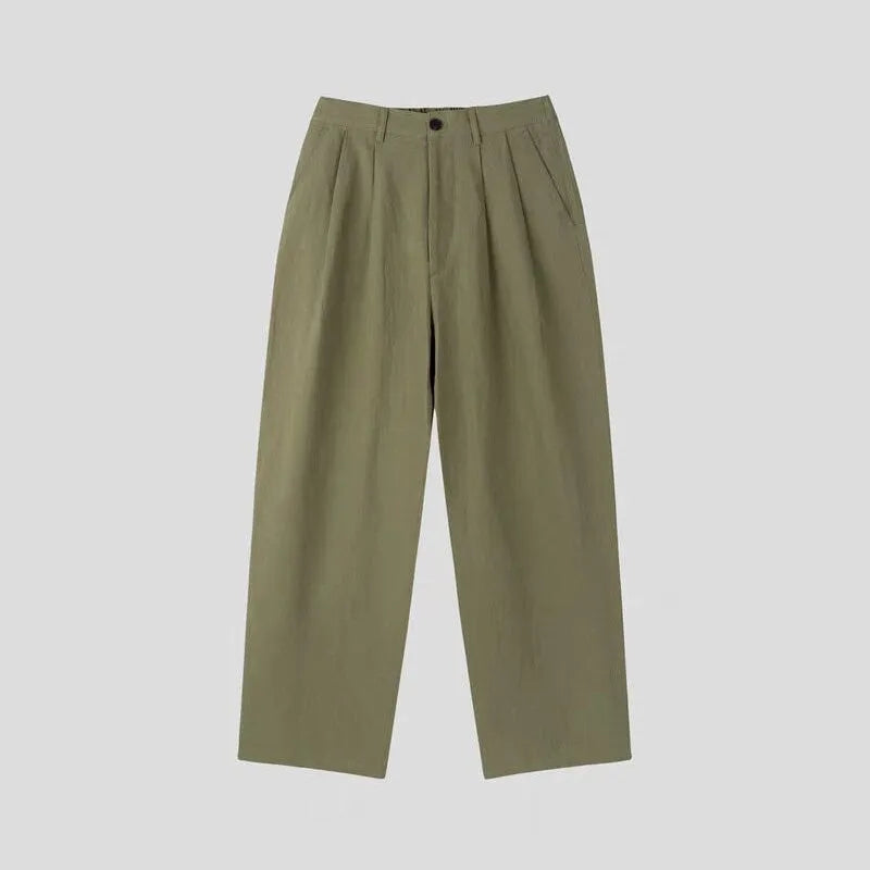 Men's loose lightweight cotton linen trousers in apricot colour showing wide-leg Korean style design