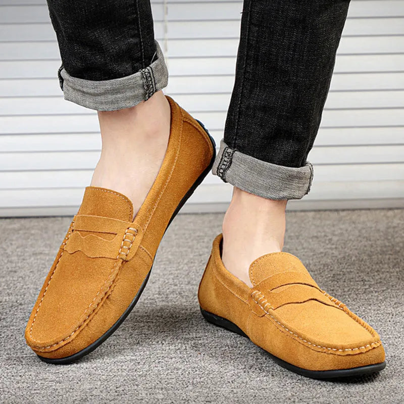 Men's brown suede loafers with round toe and flat rubber sole