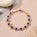Gold and silver tone zinc alloy flower bracelet with electroplated coloured gemstones including crystal and diamond accents.