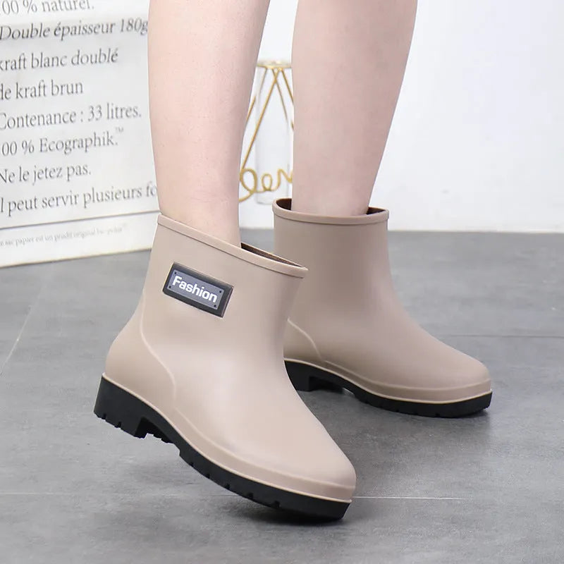 Women's mid-calf PVC rain boots in black with low heel for waterproof work footwear