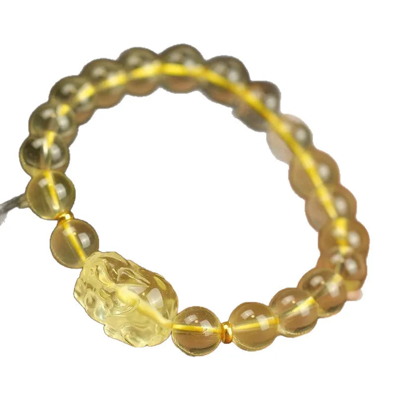 Yellow leather adjustable bracelet with citrine-coloured artificial crystal beads and a Chinese Pi Xiu charm.