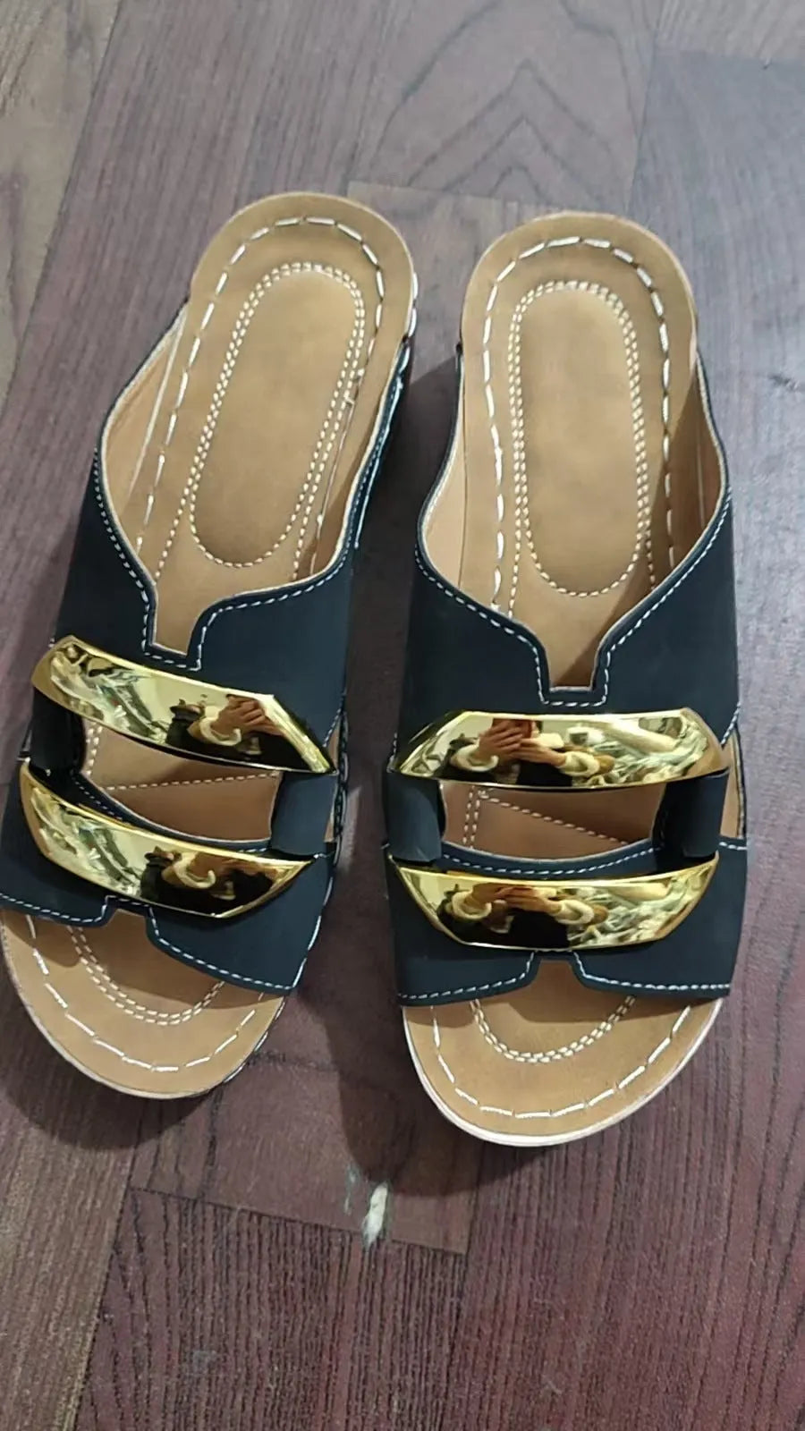 Roman style platform flip-flops in solid colour with metal decorative elements and rubber sole