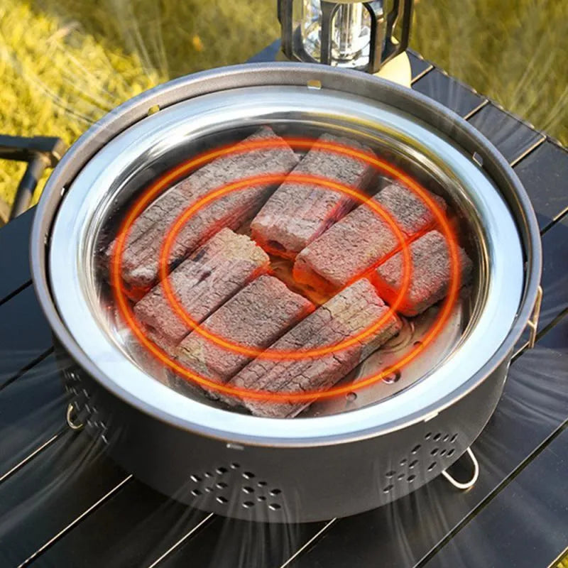 Portable stainless steel charcoal BBQ grill with detachable parts and a carry bag, shown in grey.