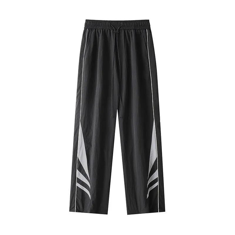 Men's straight cut loose fit casual trousers in black or grey, laid flat.