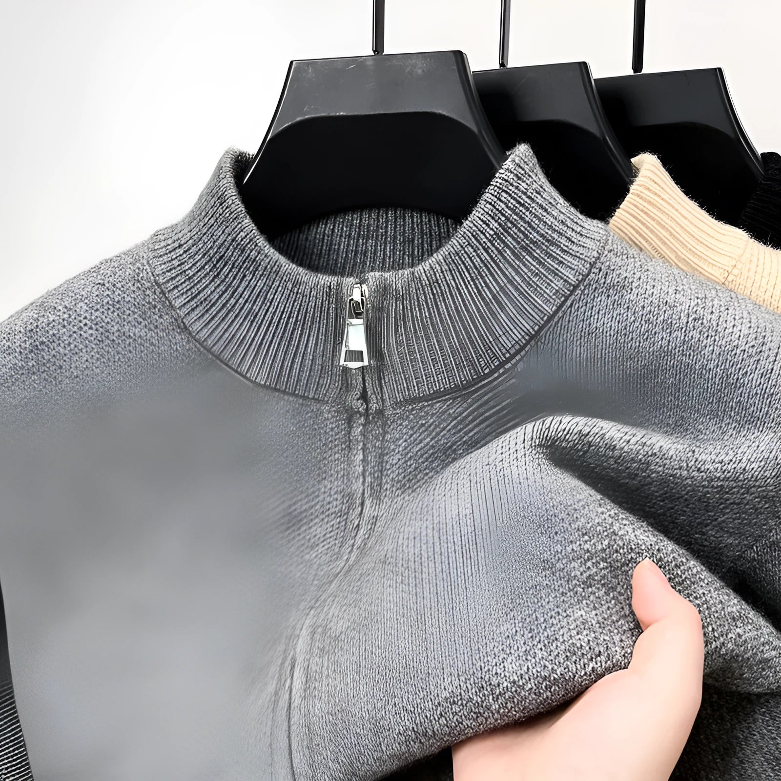 Men's loose fit knitted cardigan with a stand collar and full-length zip front in beige.
