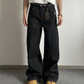 Black loose wide-leg retro jeans with a straight-leg cut and zip fly on a model.