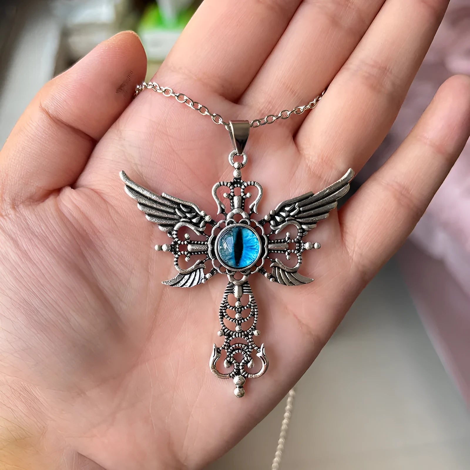 Alloy devil wings cross pendant necklace in geometric design on a chain.