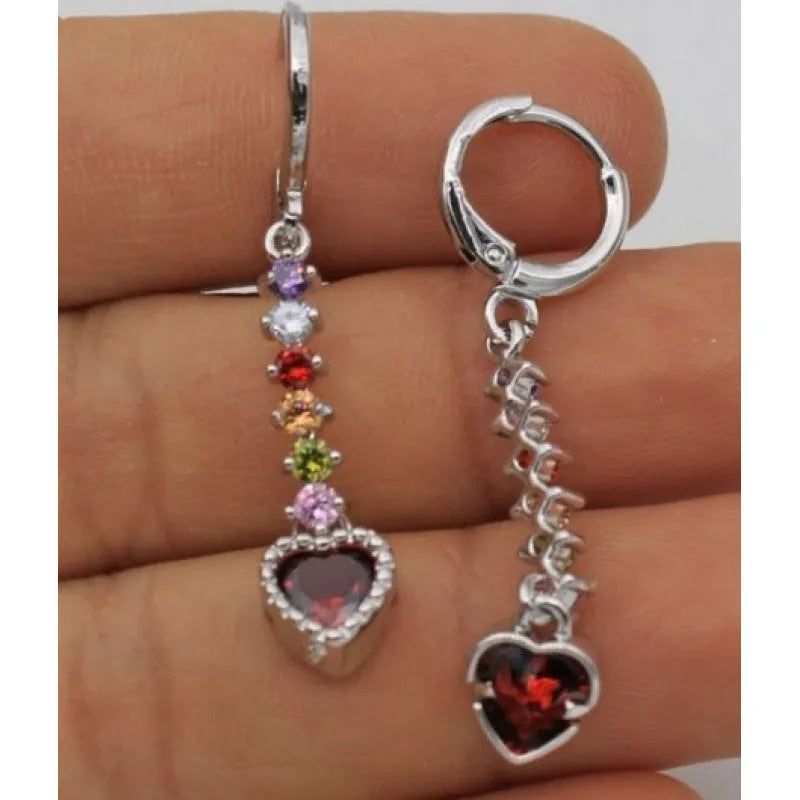A pair of women's heart-shaped drop earrings with a gold electroplated finish.