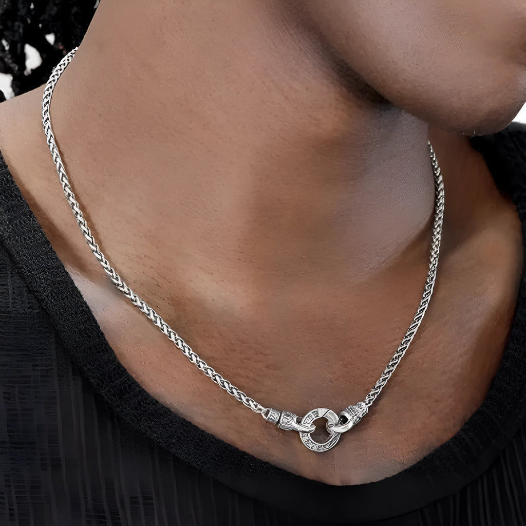 Simple sterling silver S925 necklace on a white background, showing a close-up of the chain links.