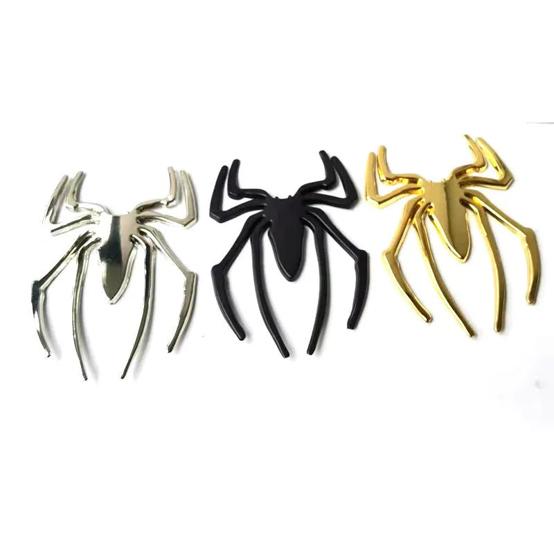 Gold 3D metal spider bumper sticker on a car bumper