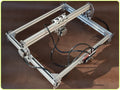 Miniature desktop laser engraving machine for marking and lettering with a 400mm x 300mm base plate.