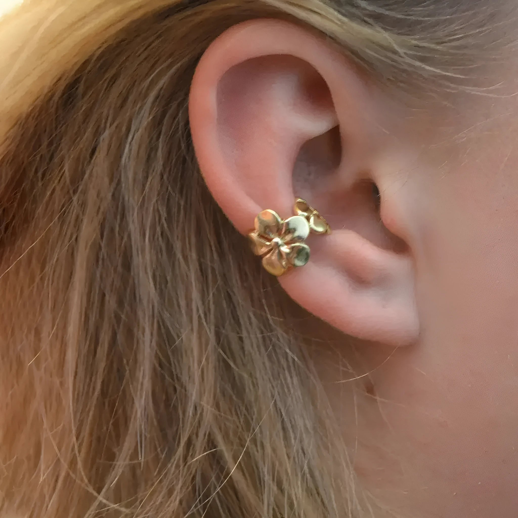Gold starfish and conch shell earrings with electroplated finish and detailed coastal designs