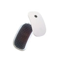 Pink handheld electric pet massage brush with soft white teeth on a table.
