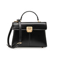 Black genuine leather women's shoulder bag with clasp closure showing square shape and adjustable strap