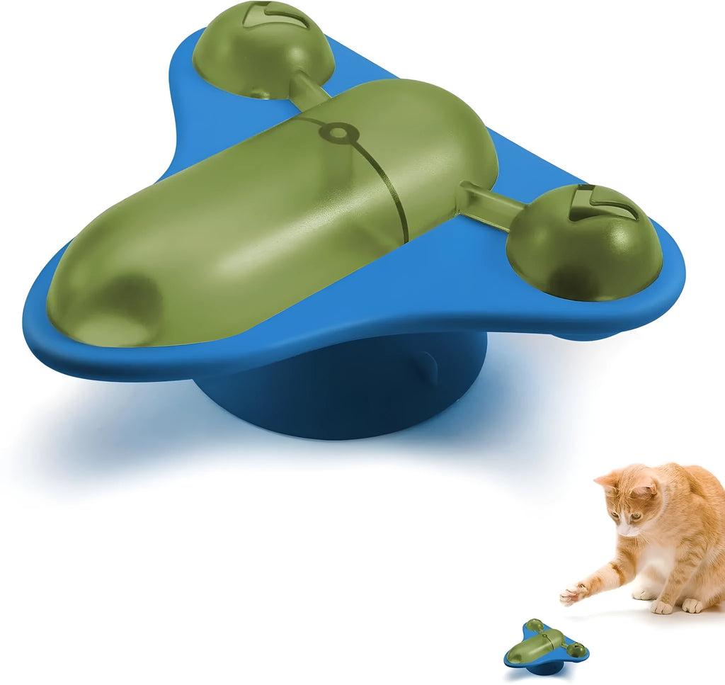 Blue interactive pet puzzle toy with bell, catnip pouch, and clear snack cabin on a suction cup base.