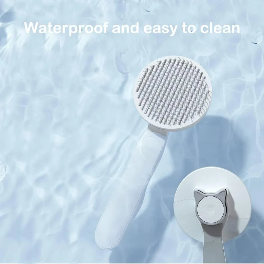 Blue self-cleaning cat and dog grooming brush with rubber handle and metal pins.