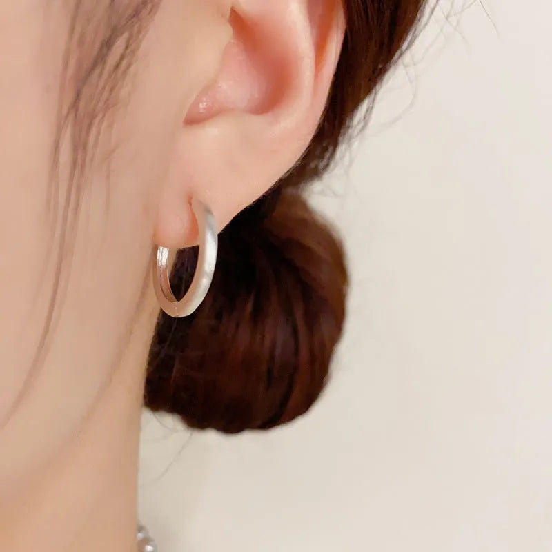 Geometric circular ear clips with gold plating in gold and silver colour options