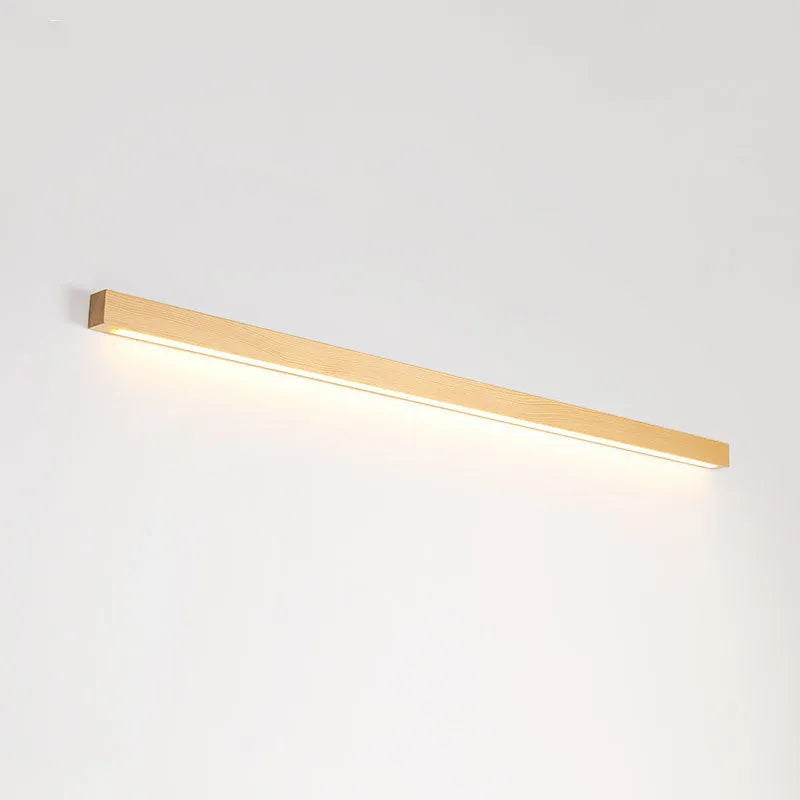 Walnut colour solid wood and acrylic LED strip wall lamp in three different lengths.