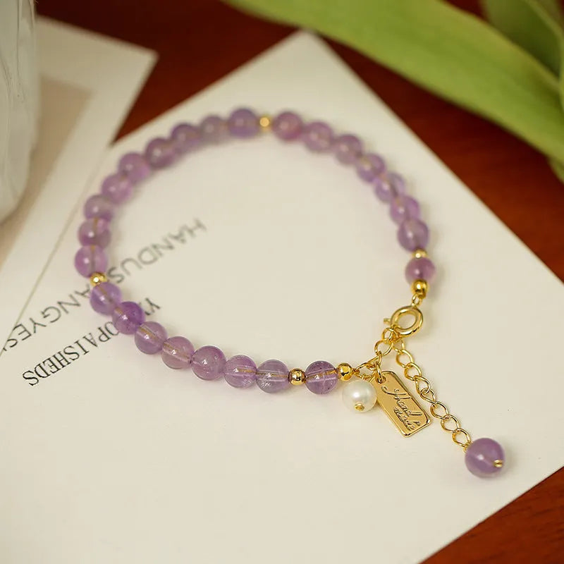 Women's lavender amethyst crystal bracelet with animal zodiac design in dark and light colour options
