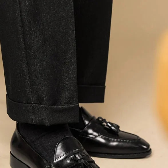 Men's black tassel loafers with genuine leather upper and British style detailing
