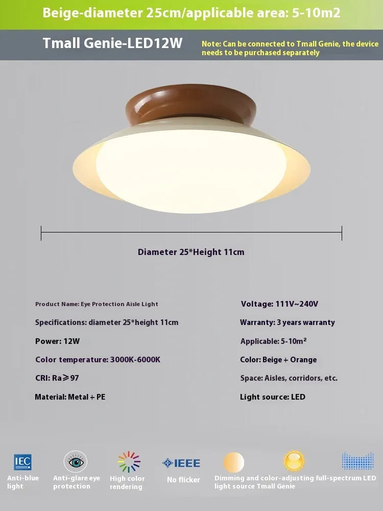 Modern minimalist flying saucer ceiling lamp with a shallow dome iron shade in a cream colour.